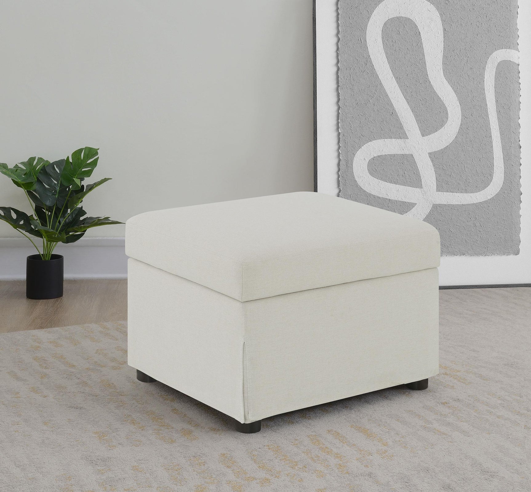 Close-up of hydraulic lift mechanism on beige ottoman