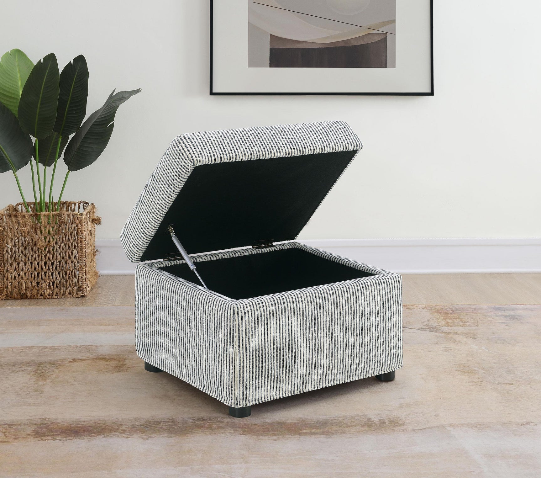 Grey fabric cushioned ottoman side angle