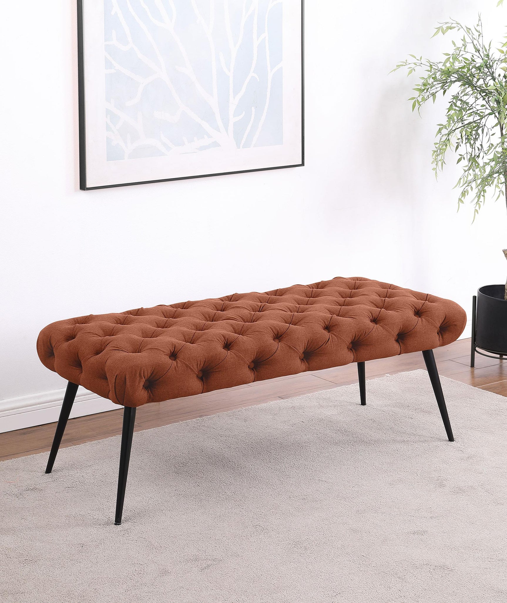 Ella Upholstered Tufted Bench showing metal legs, side angle