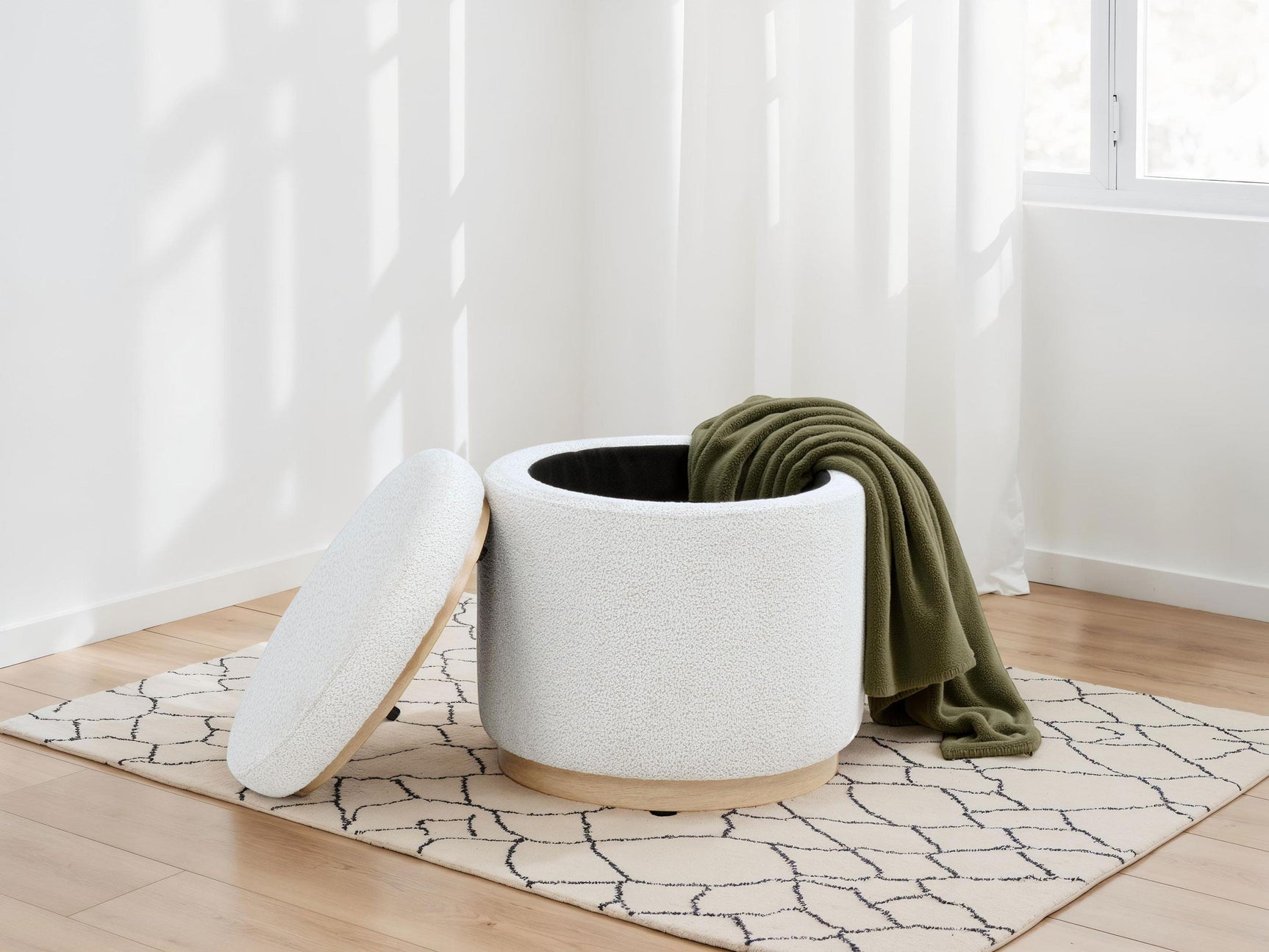 Ivory boucle fabric close-up on Remuda round ottoman