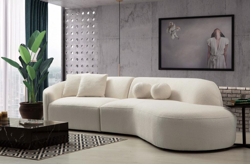 Close front view of Ava Ivory Boucle Curved 134" RAF Sectional sofa