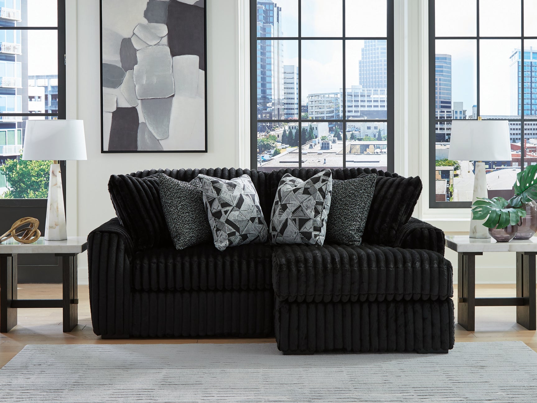 Room view featuring Midnight-Madness Onyx 2-Piece Sectional with Chaise