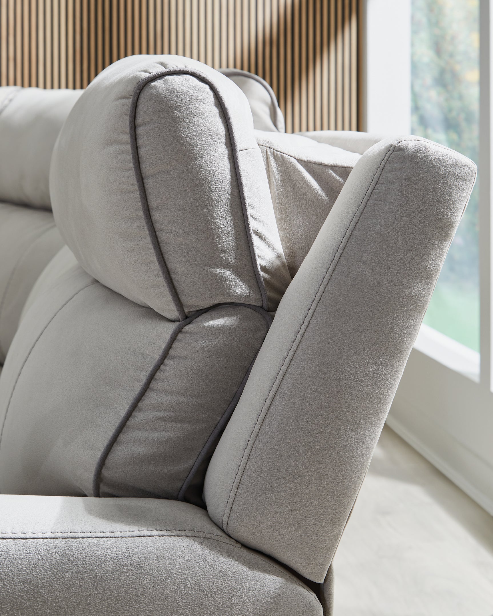 Adjustable headrest on power recliner
