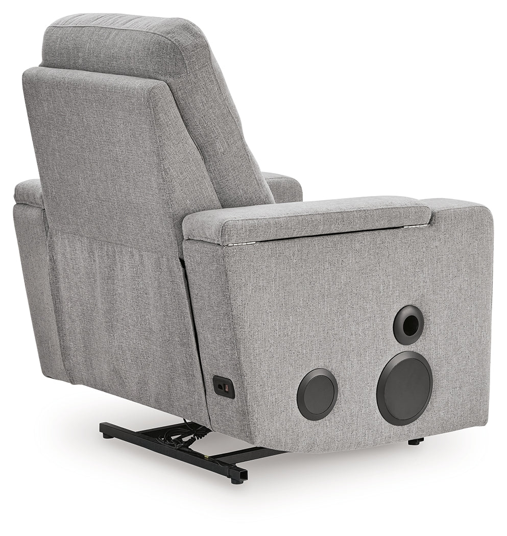 Close-up of USB port and cup holder on recliner arm