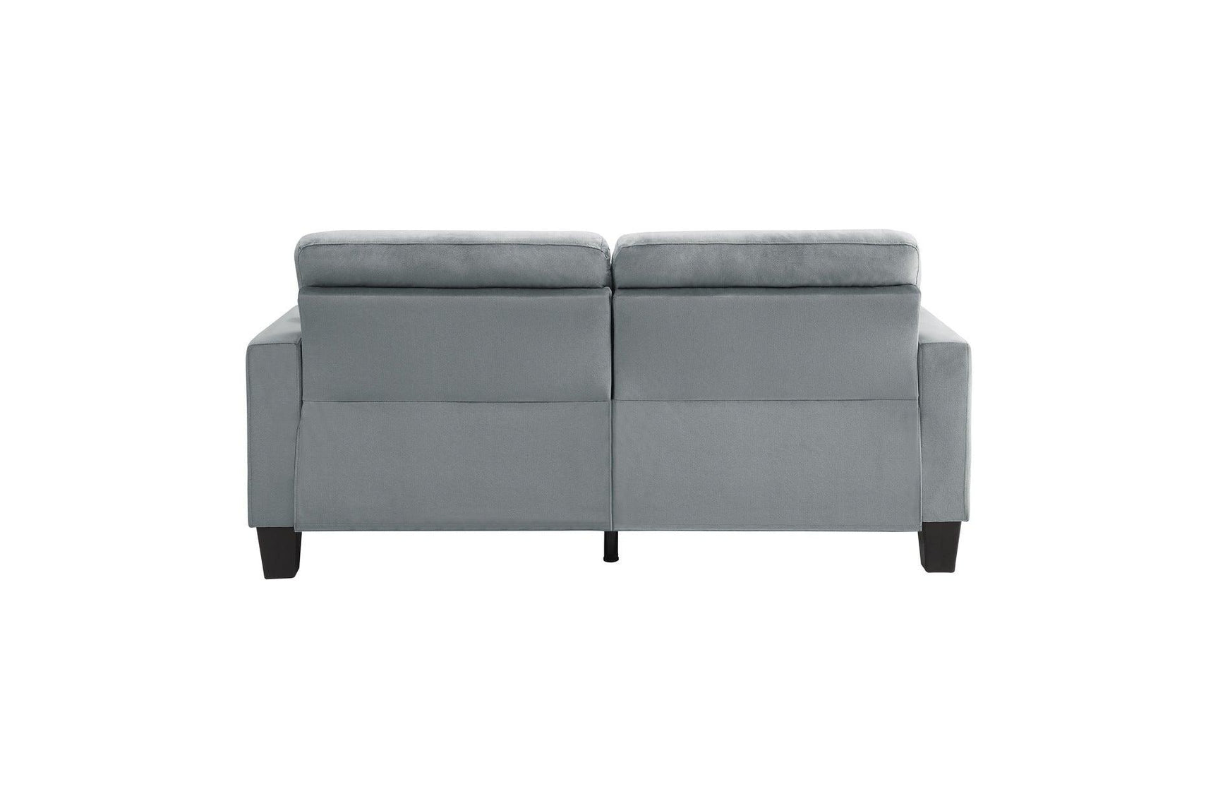 Angle view of gray tufted sofa cushions