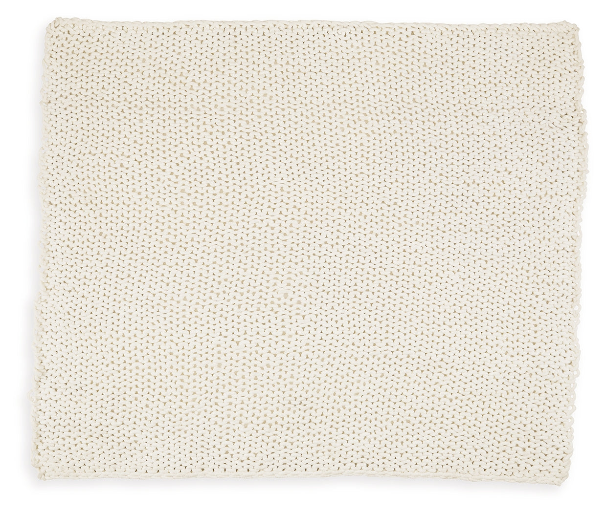 Close-up of hand-knitted texture on ivory throw