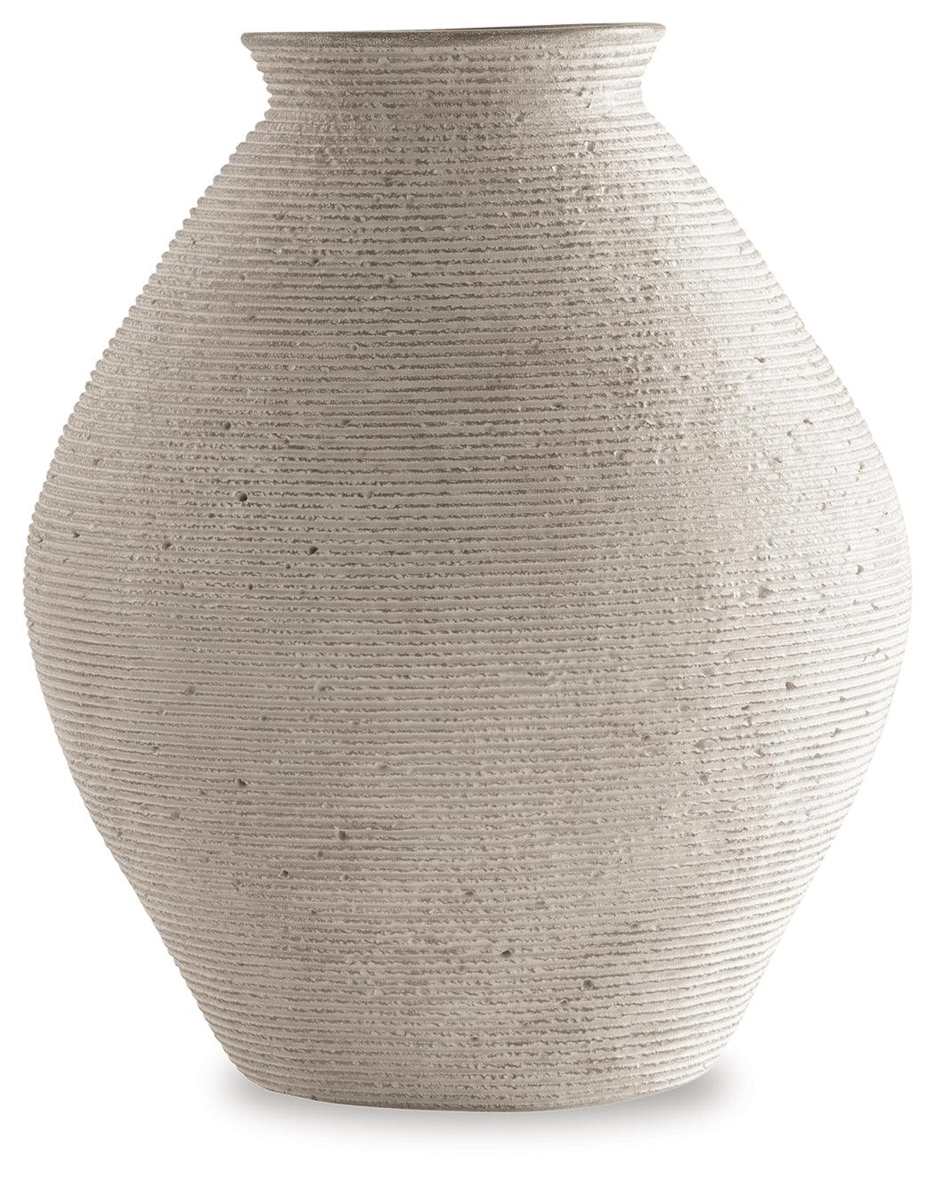 Side angle of Hannela Antique Tan Vase highlighting artisanal rings