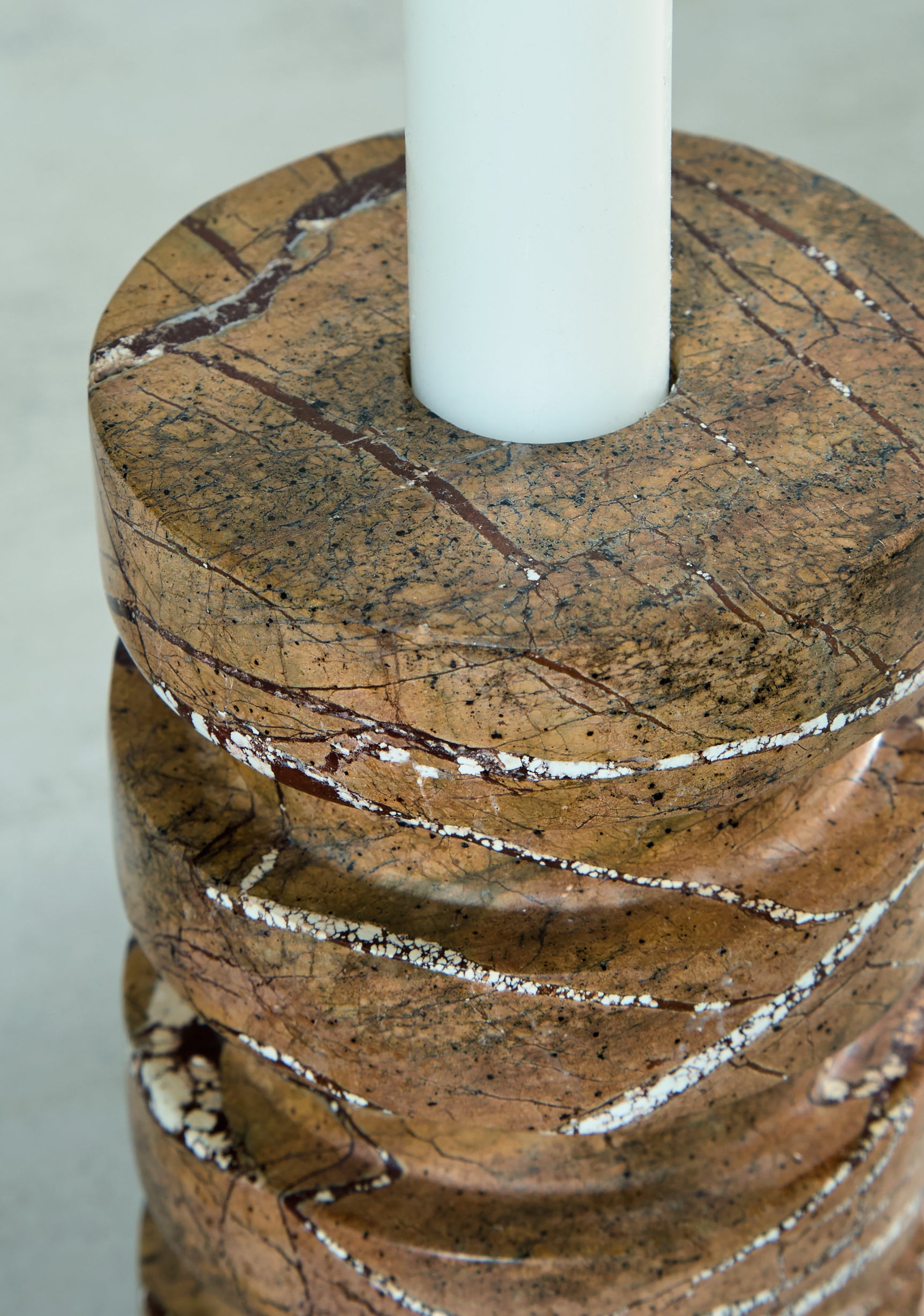 View of candle holder base and tan finish