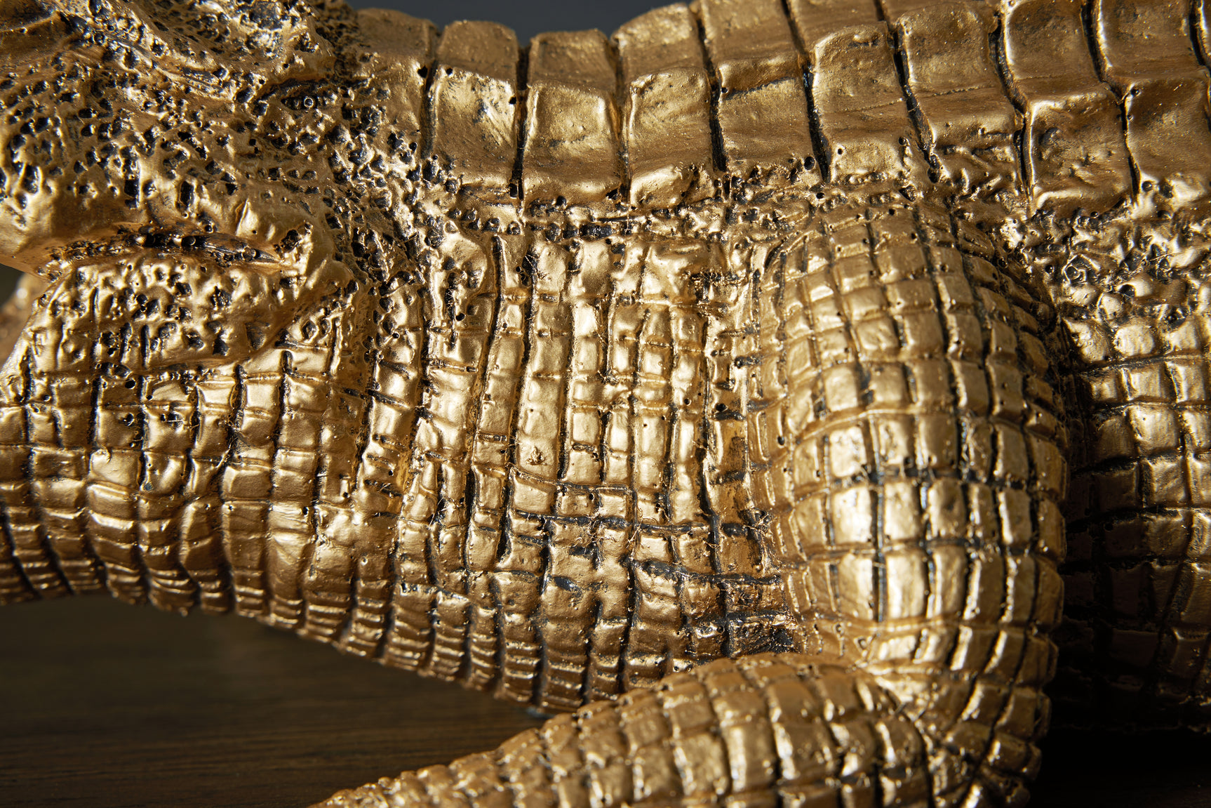 Antique gold finish detail on Lauretman sculpture