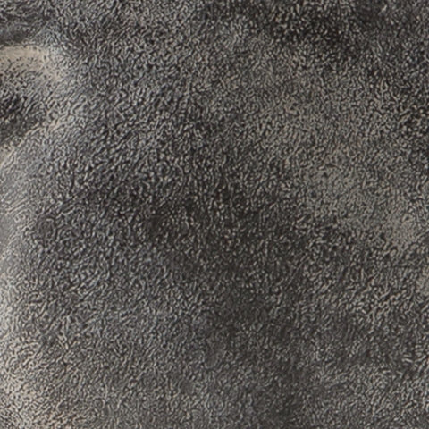 Close-up of the antiqued black finish and texture on Carnlow sculpture