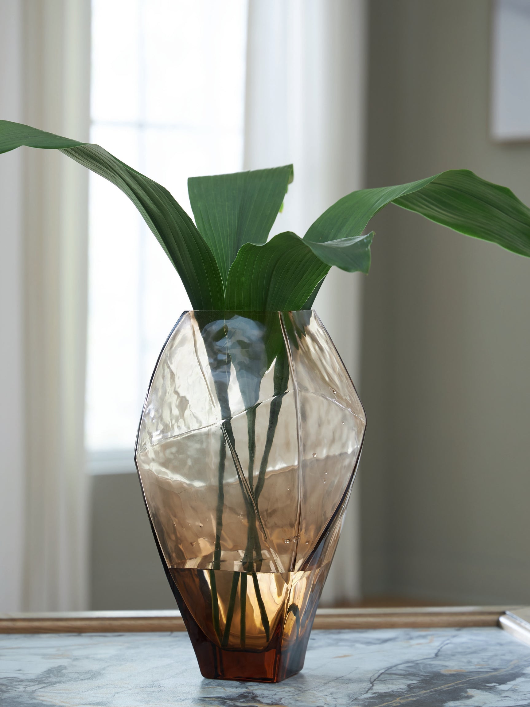 Ewart Vase displayed in a modern living room