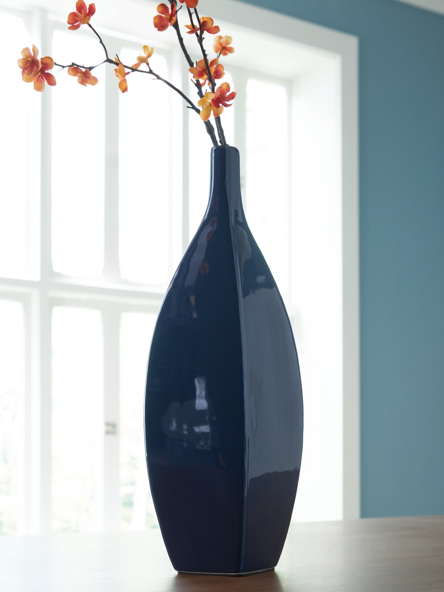 Abtinson navy vase shown with dried florals