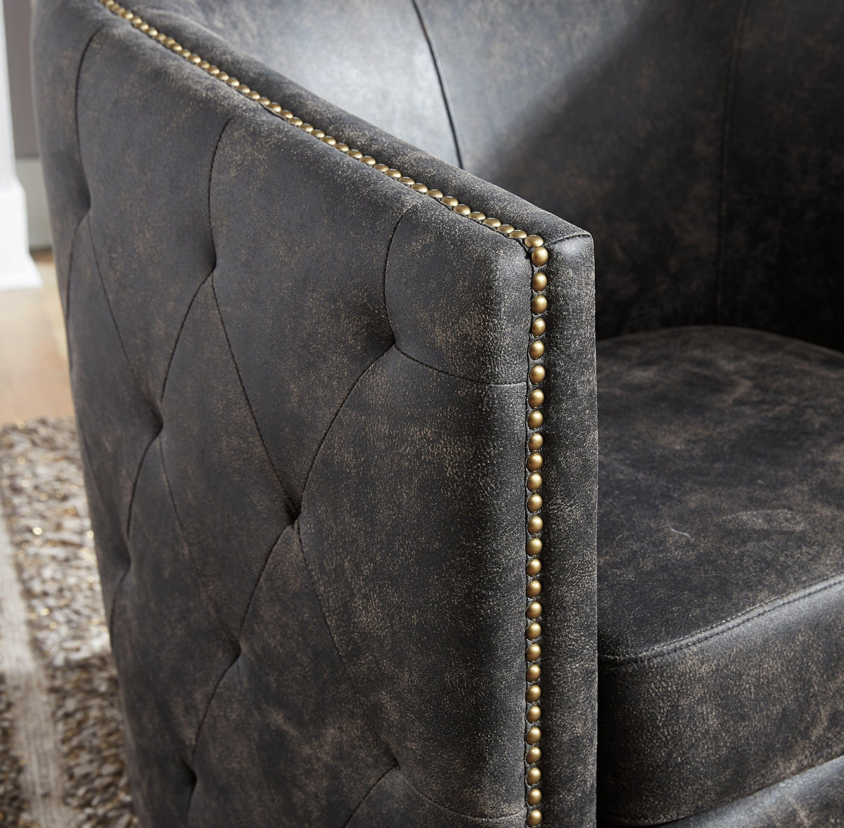 Close-up of tufted sides and nailhead trim on Brentlow chair