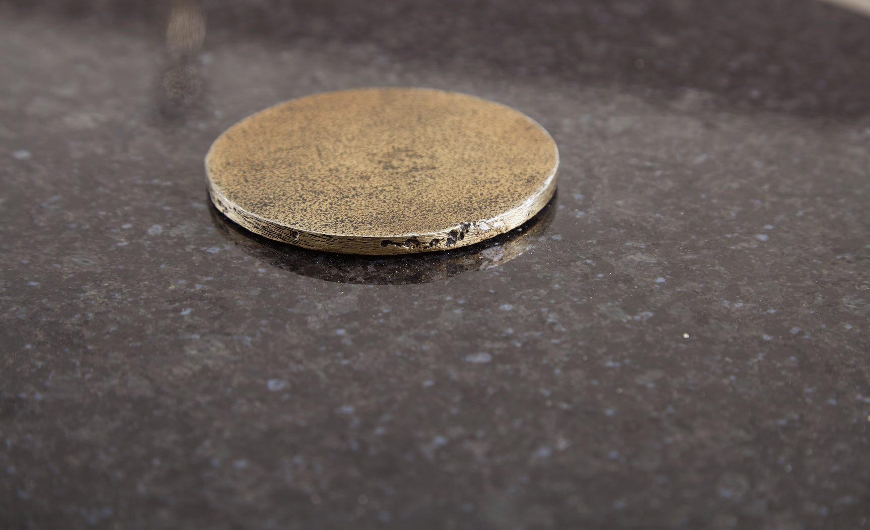 Close-up of antique gold finish on cast aluminum frame