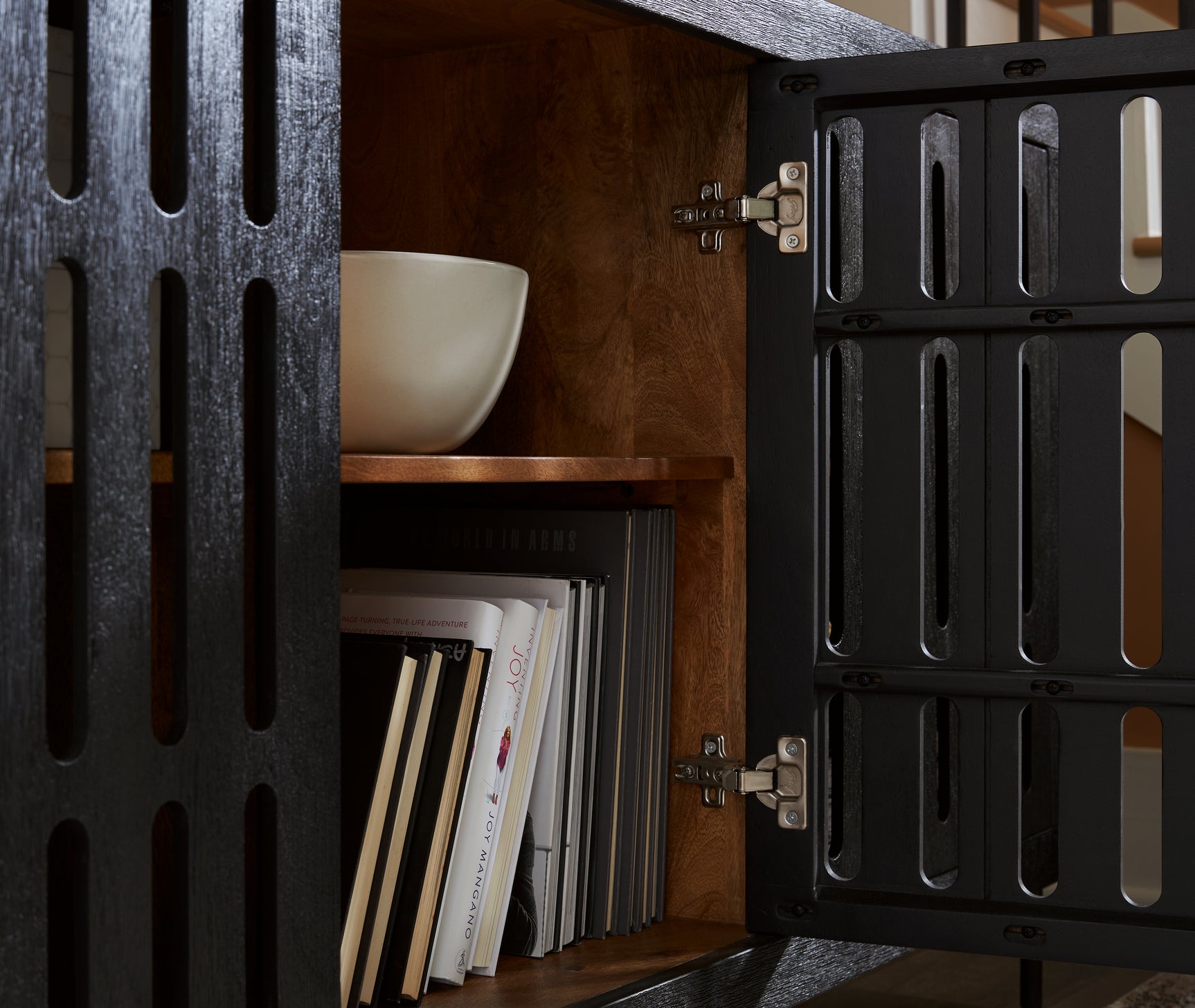 Open door showing interior natural finish and adjustable shelf