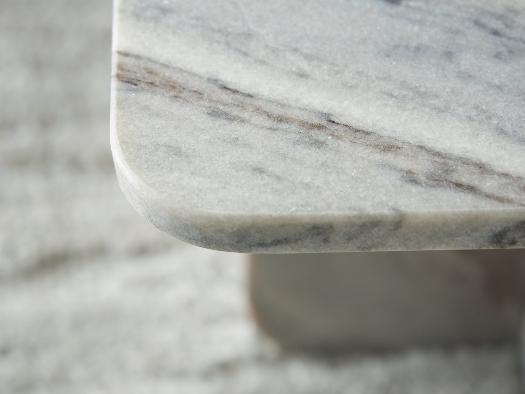 Profile shot highlighting marble texture of Baretton table