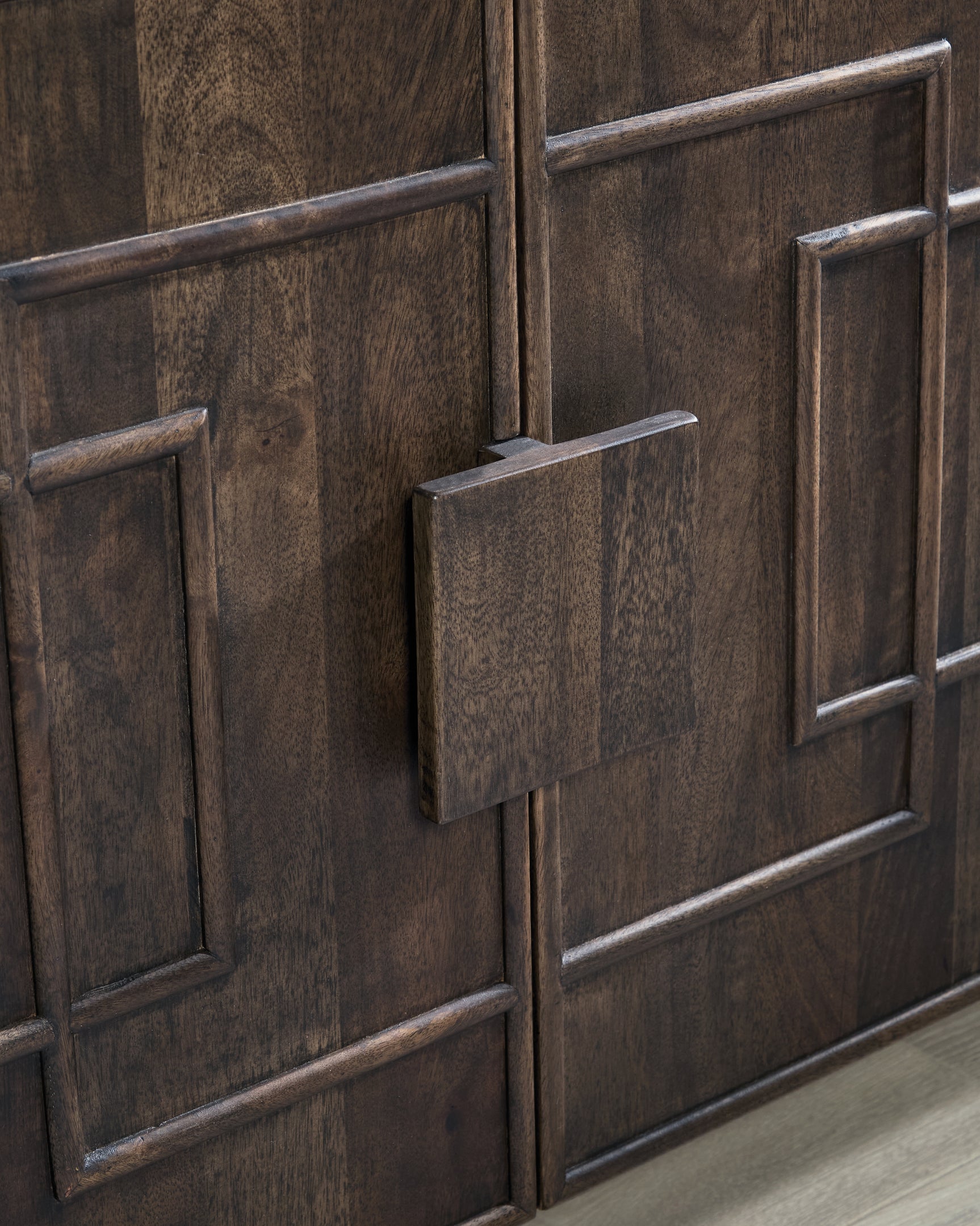 Close-up of oversized wood door pulls