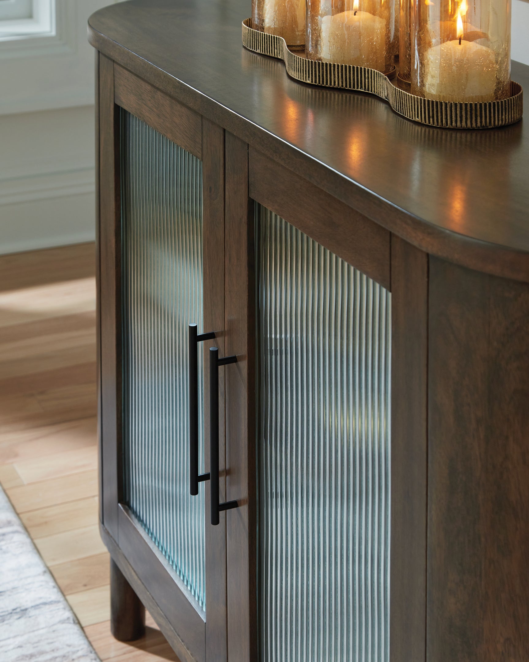 Close-up of Mayridge Accent Cabinet wood and glass detail