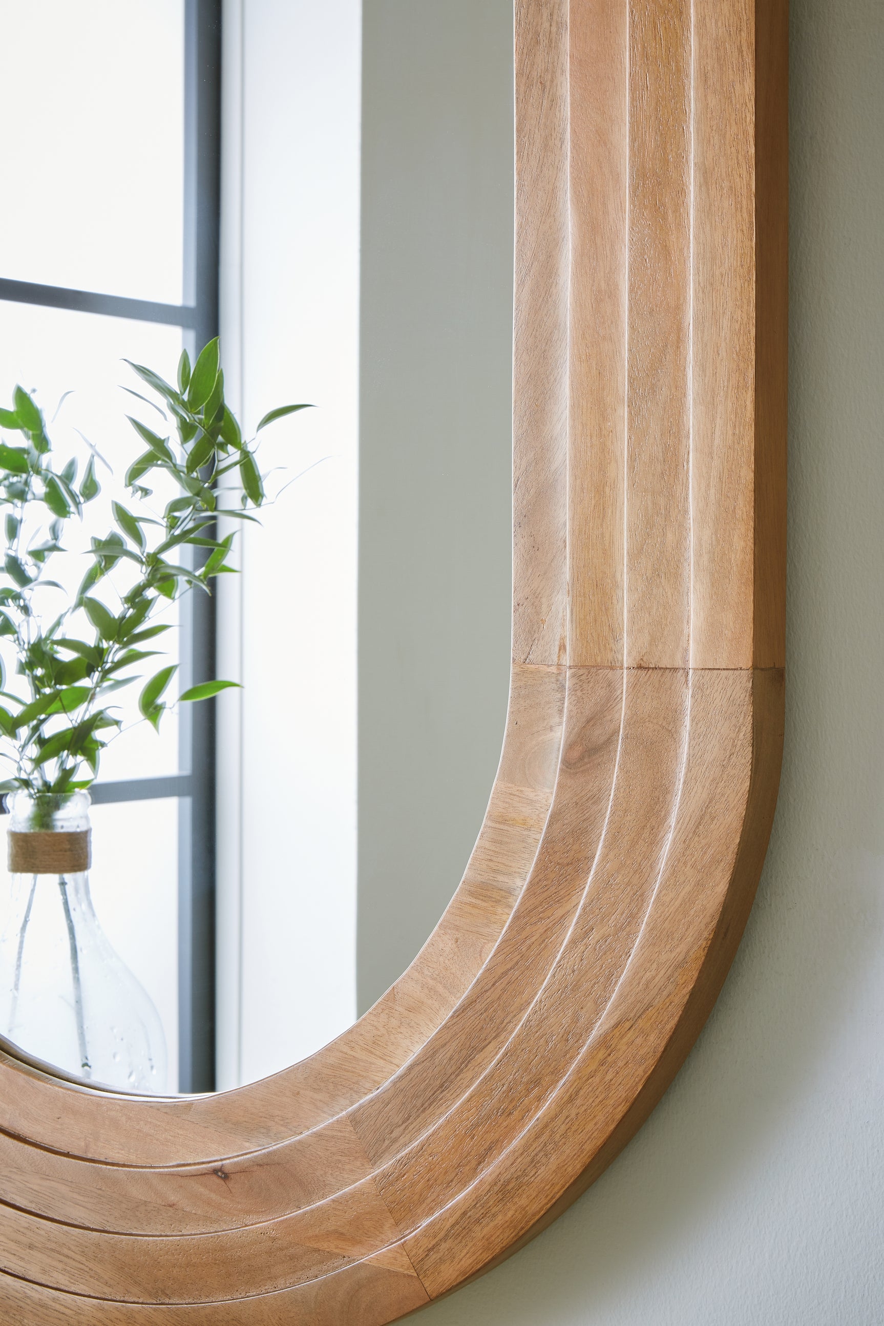 Close-up detail of Daverly mirror wood frame corner