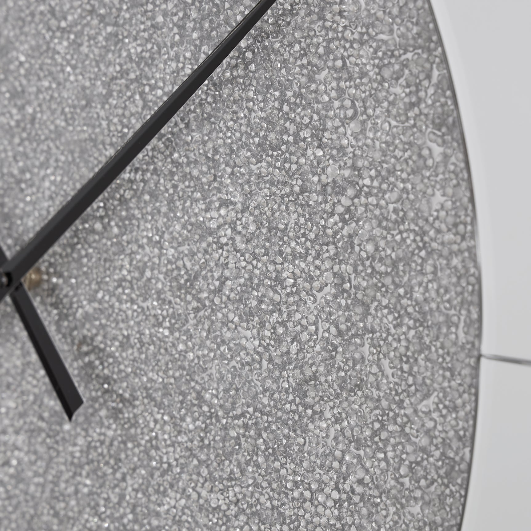 Reinport mirror wall clock hanging on wall in a contemporary living room