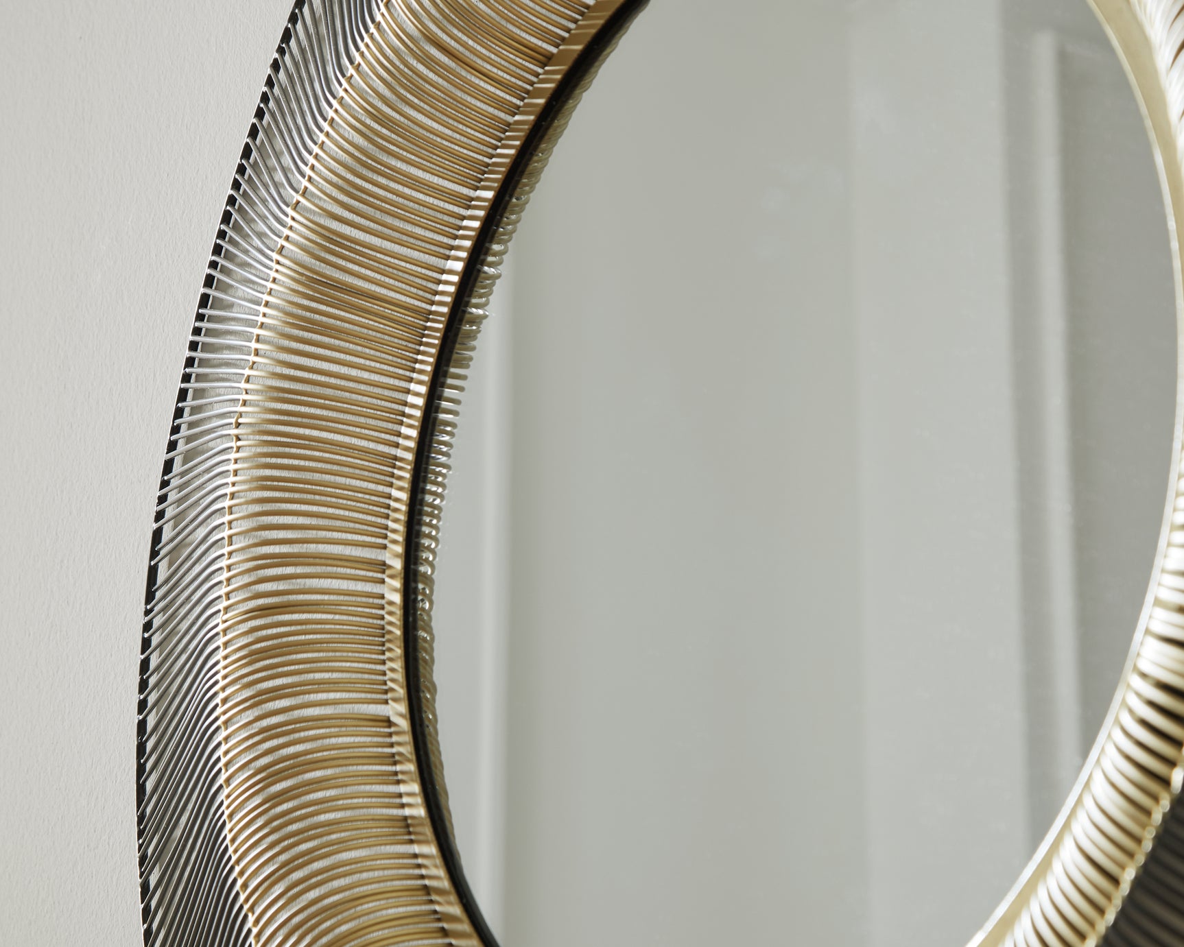 Close-up detail of Dallmen accent mirror metal finish