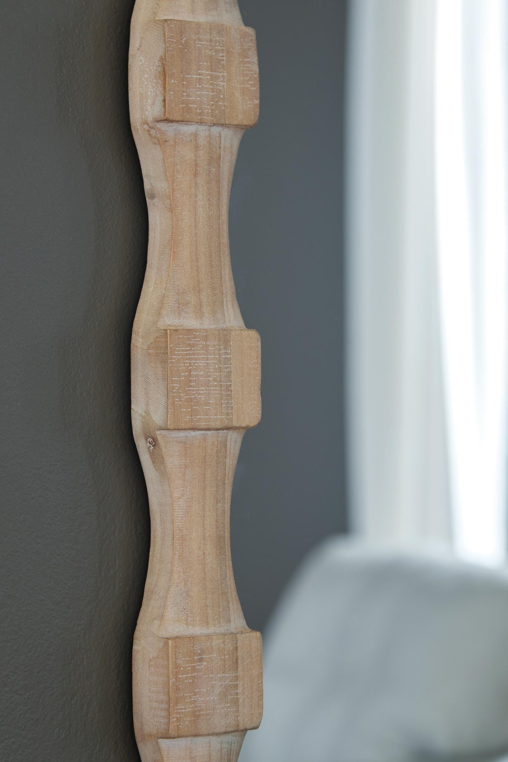 Detail of light brown wood frame finish