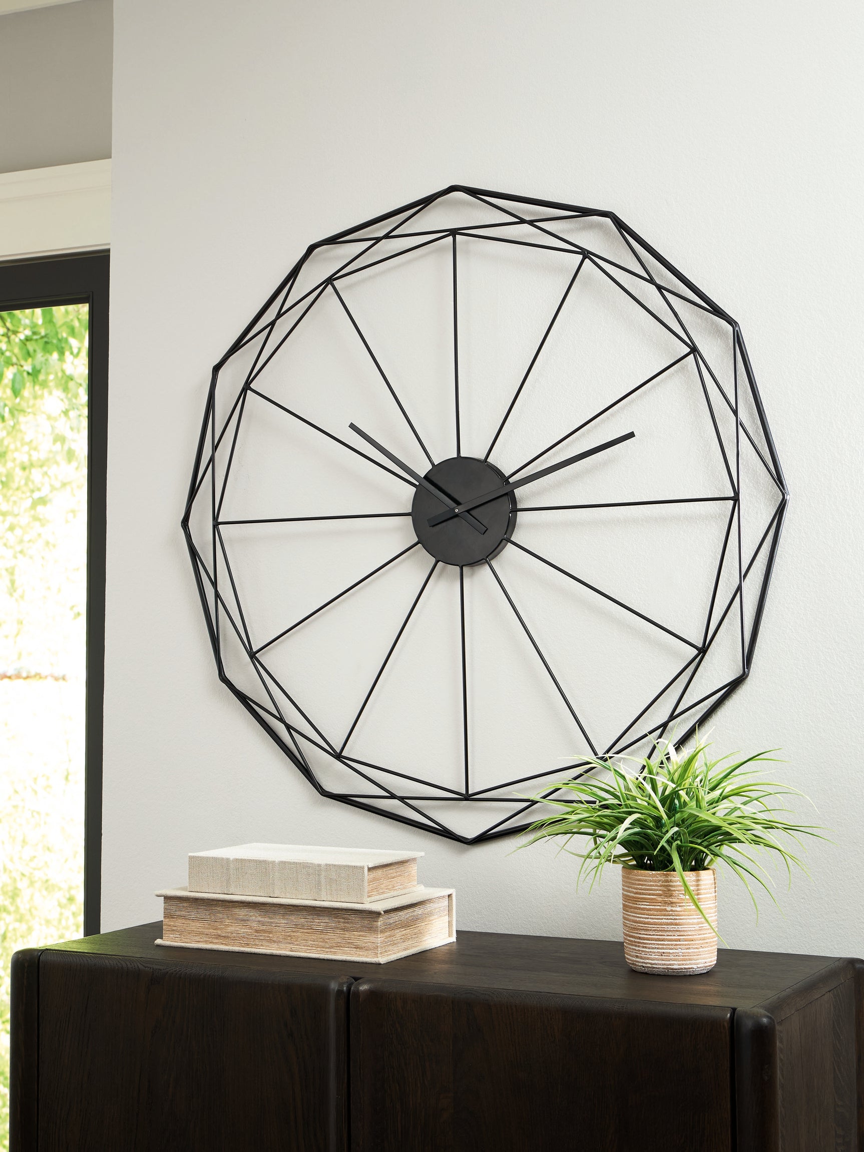 Close-up angled view of Arkthorne black metal wall clock design