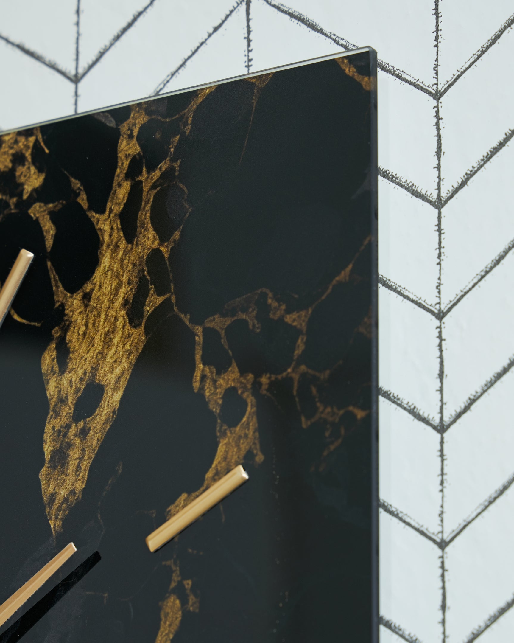 Close-up detail of clock face and goldtone metal frame