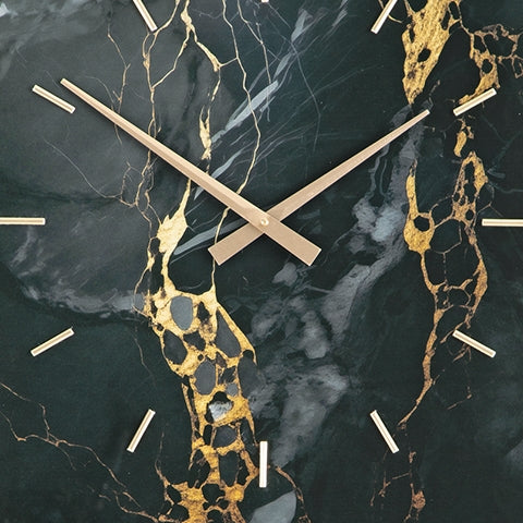 Swatch showing black and gold color pattern on clock
