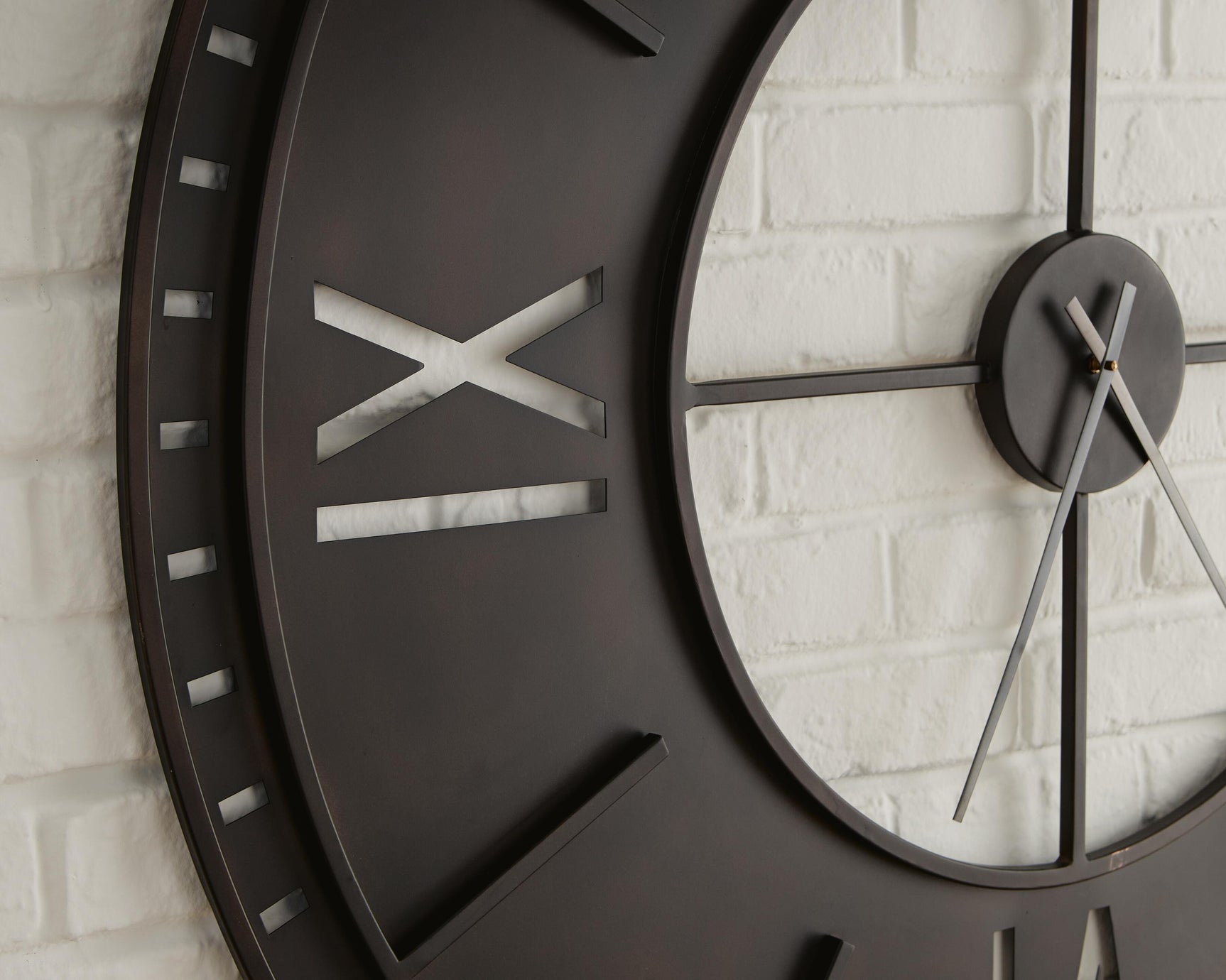 Close-up detail of Lytle wall clock metal frame and numerals