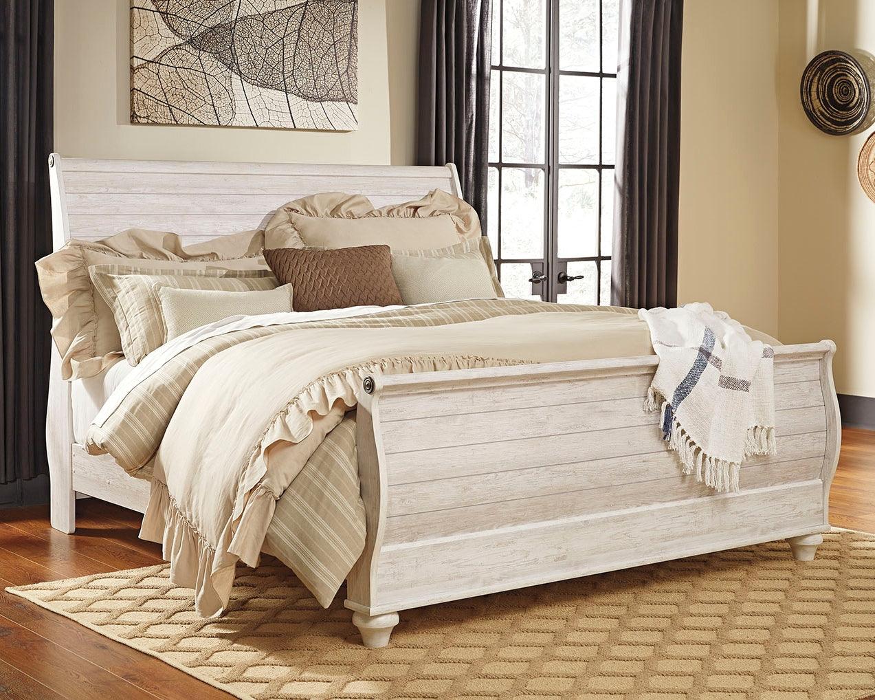 Willowton Whitewash King Sleigh Bed angled view in bedroom