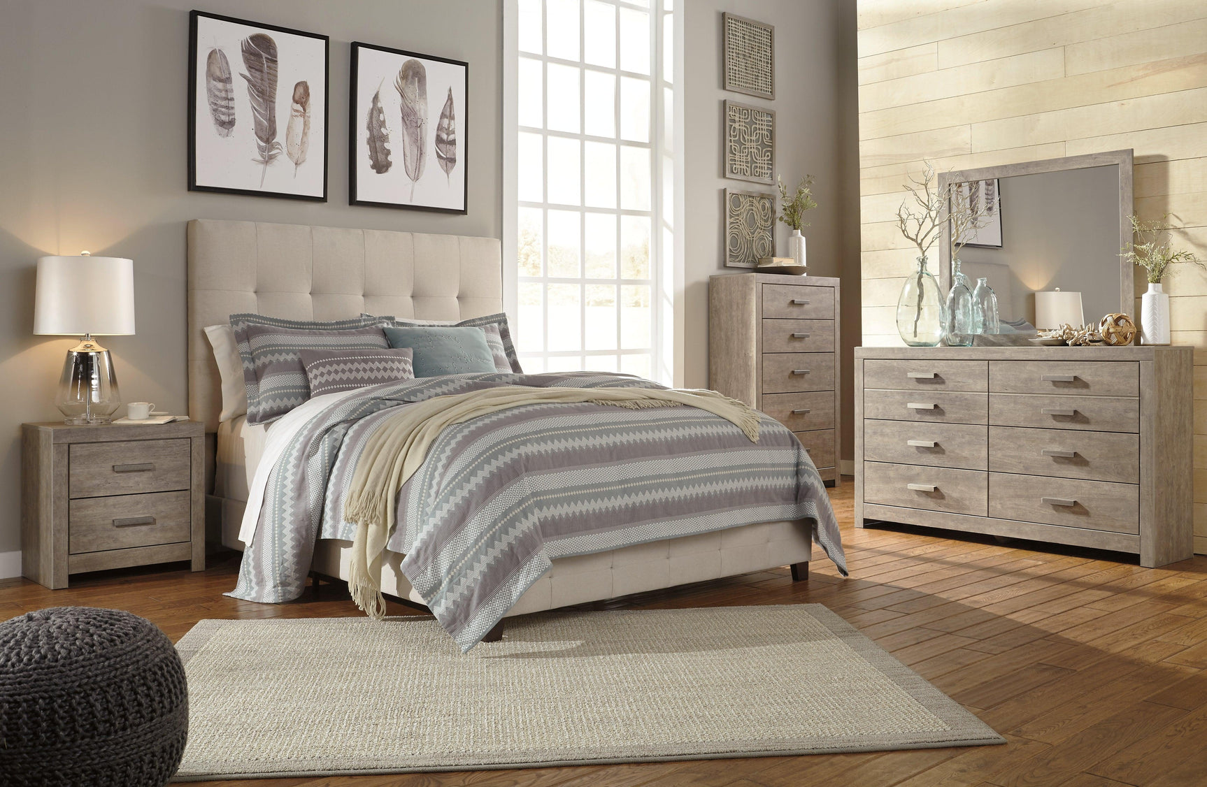 Culverbach Gray Chest Of Drawers in bedroom setting showing storage capacity