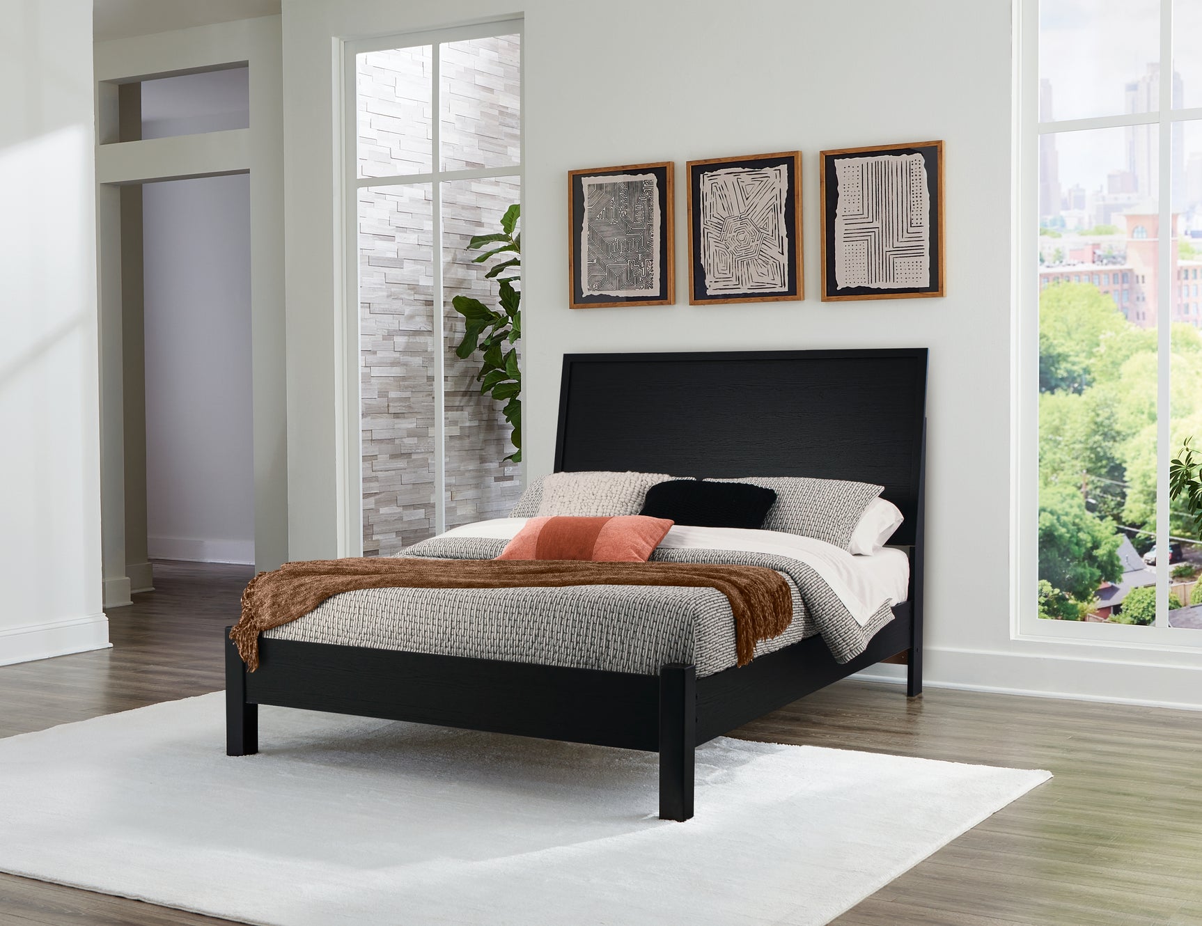 Danziar Black Full Panel Bed in ambient light