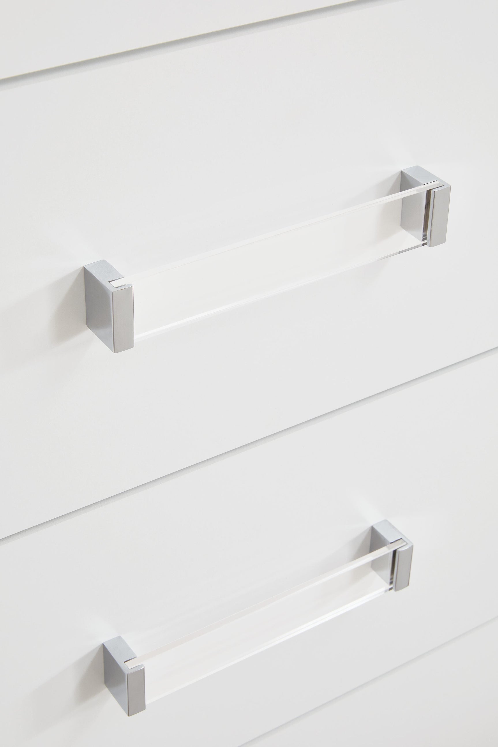 Close-up of acrylic and chrome-tone handles on Maeling chest