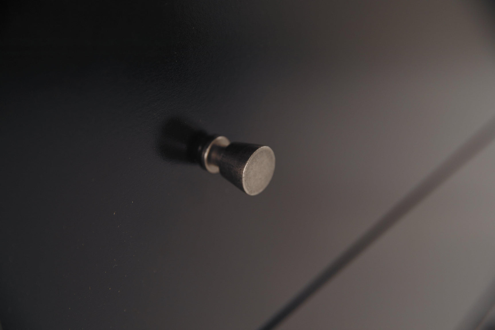 Detail of base molding on Maribel Black Dresser