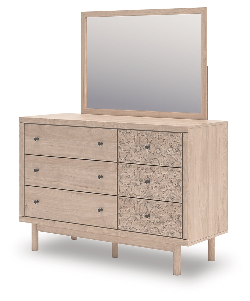 Open drawer view of Arloster Dresser revealing lined interior