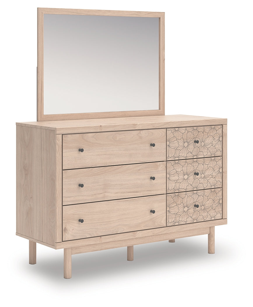 Angled side view of Arloster Tan Dresser showing oak grain finish