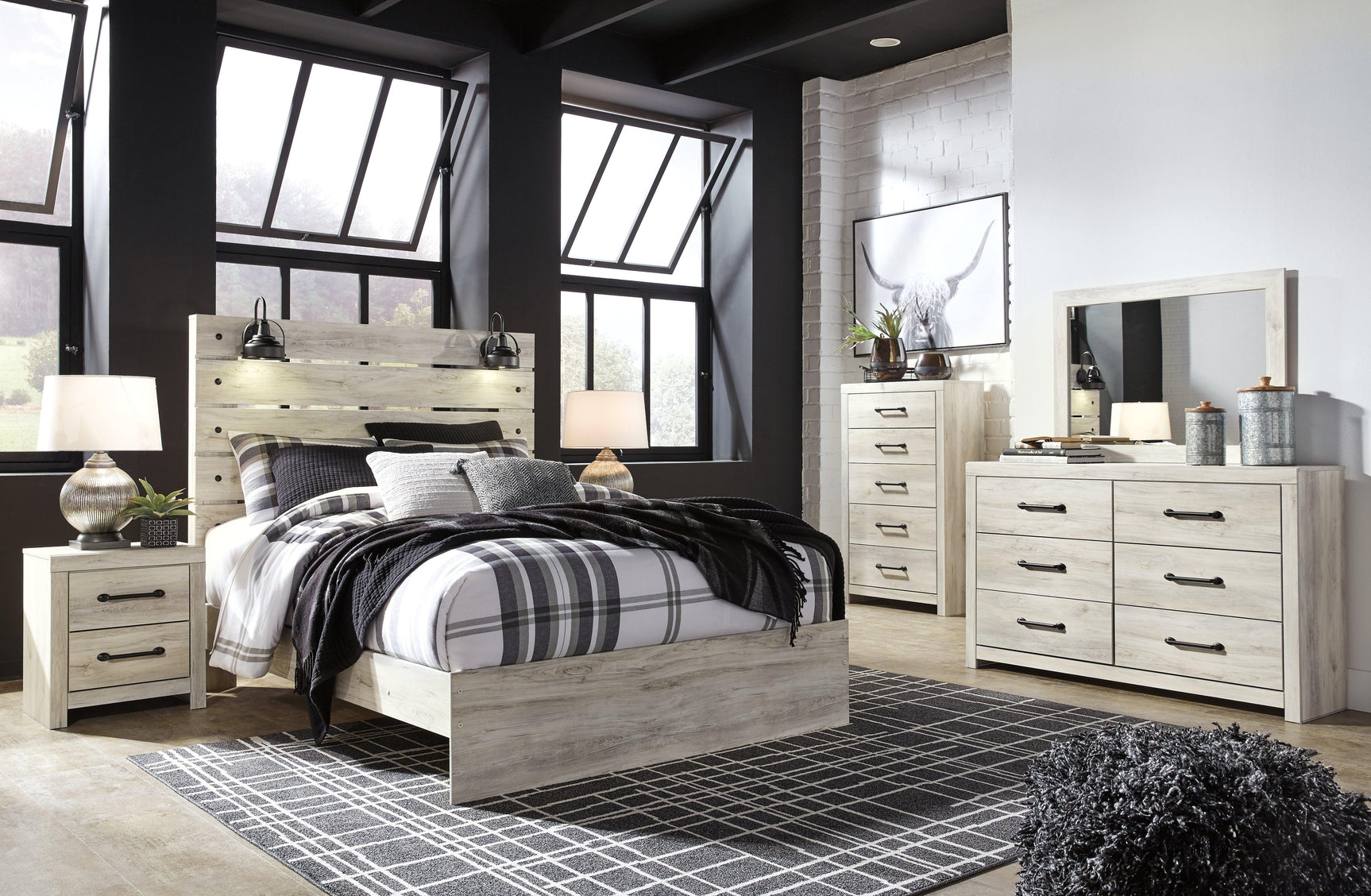 Close-up of dark industrial drawer hardware and whitewash finish