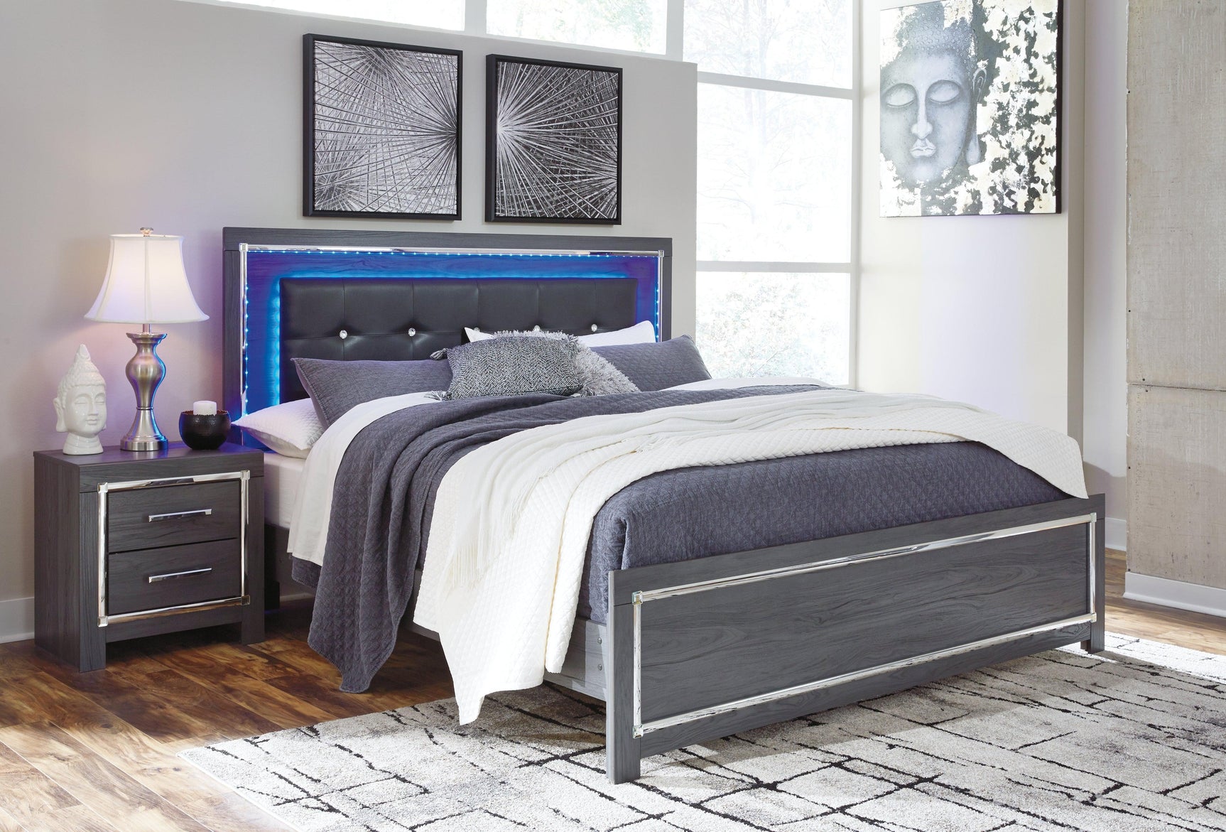 Close-up of Lodanna bed button-tufted faux leather headboard