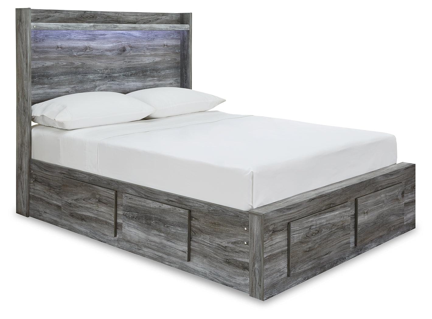 Baystorm Gray Full Panel Storage Bed angled side view showing 4 storage drawers