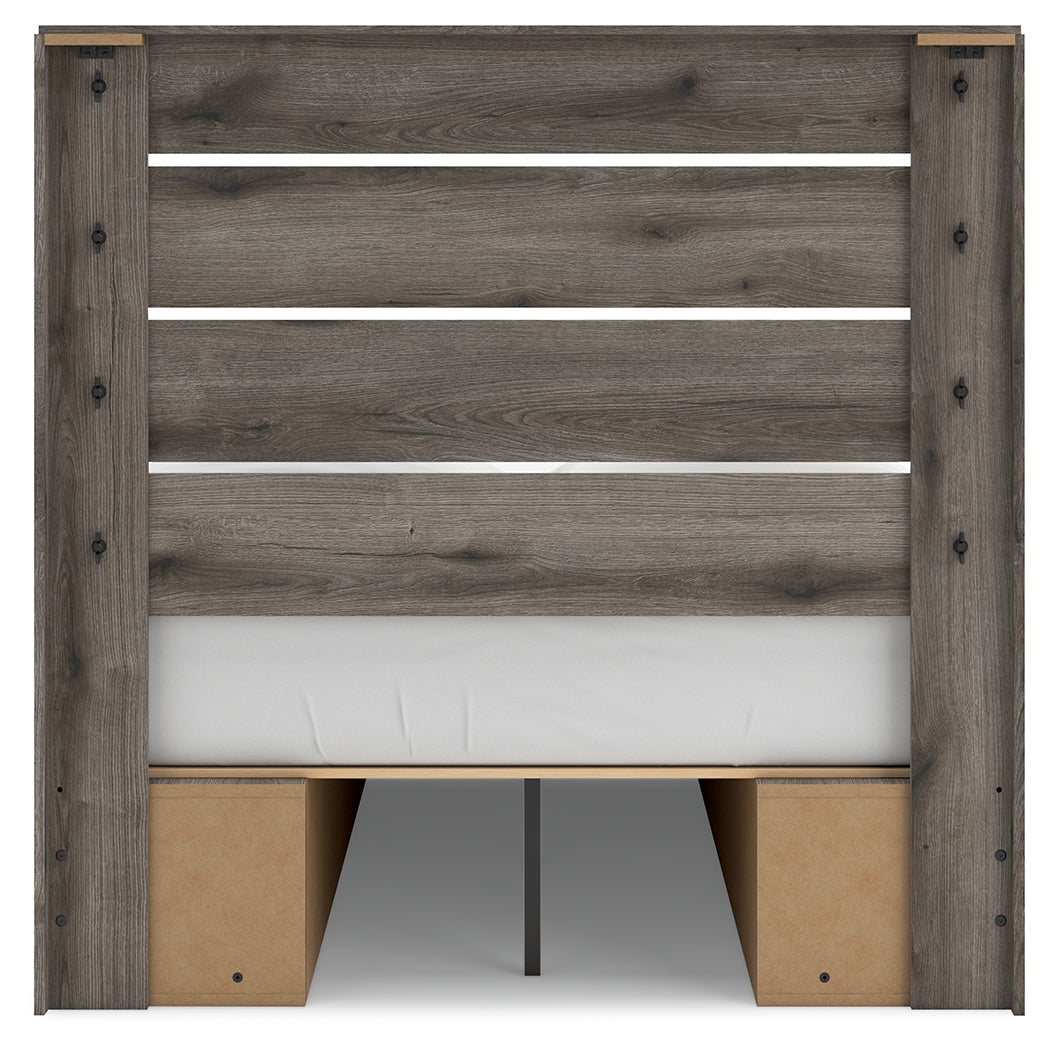 Side alternate angle of bed frame showcasing weathered brown gray finish