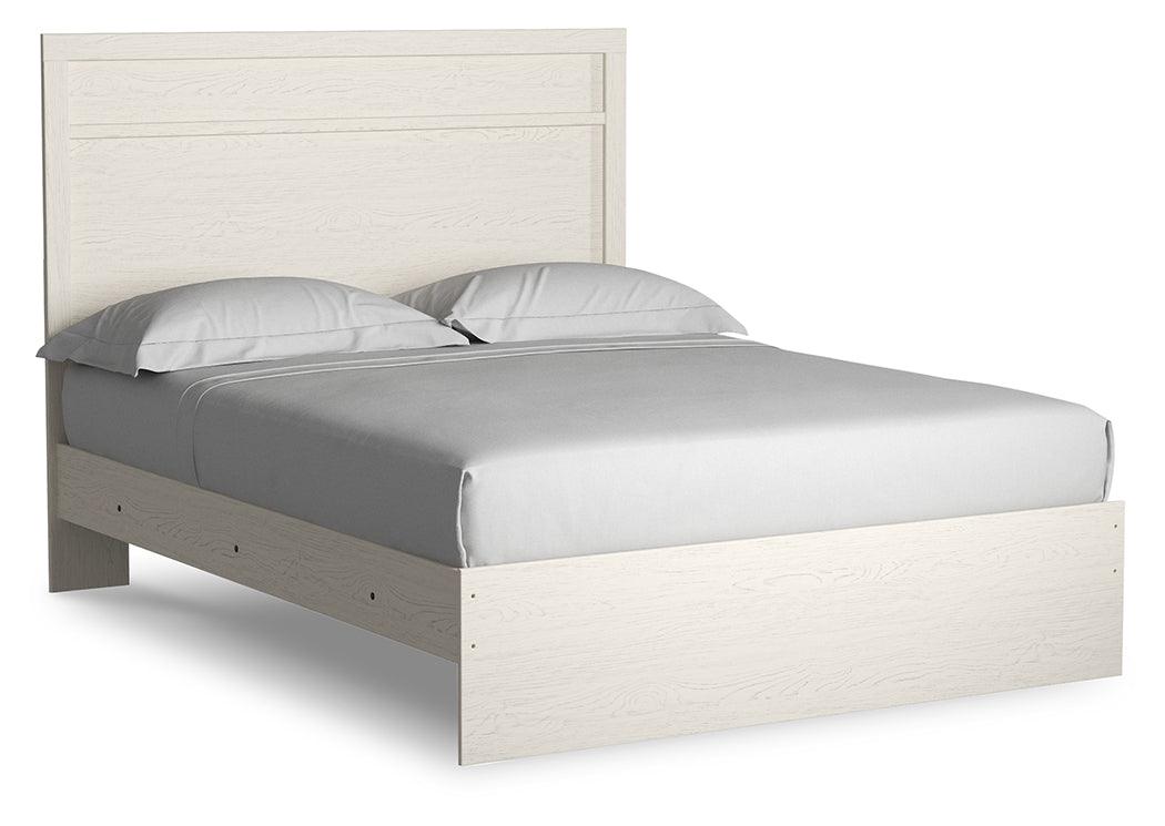 Close-up of Stelsie White Queen Panel Bed headboard with plank style molding