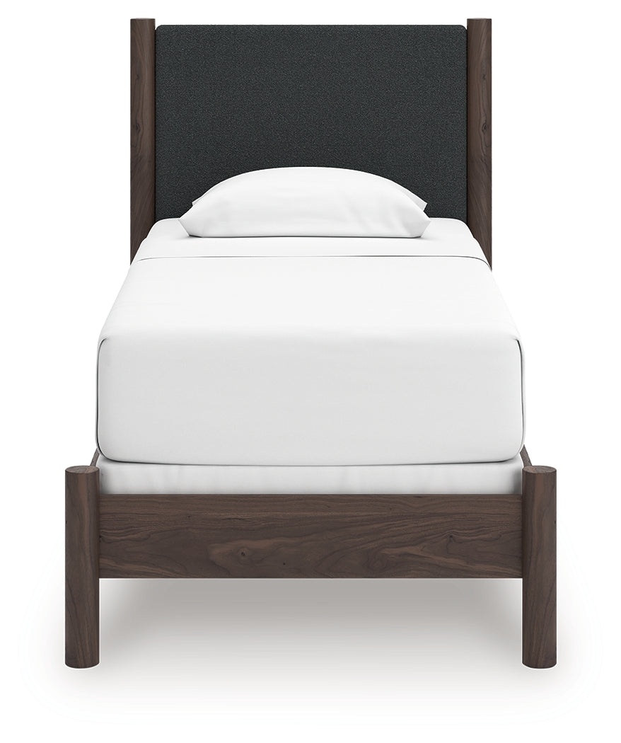 Pamytta Brown Twin Upholstered Panel Bed head-on view showing upholstered panel headboard
