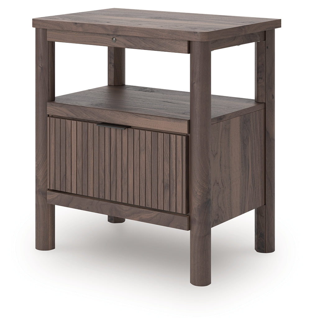 Side angle of Pamytta nightstand with ambient lighting on