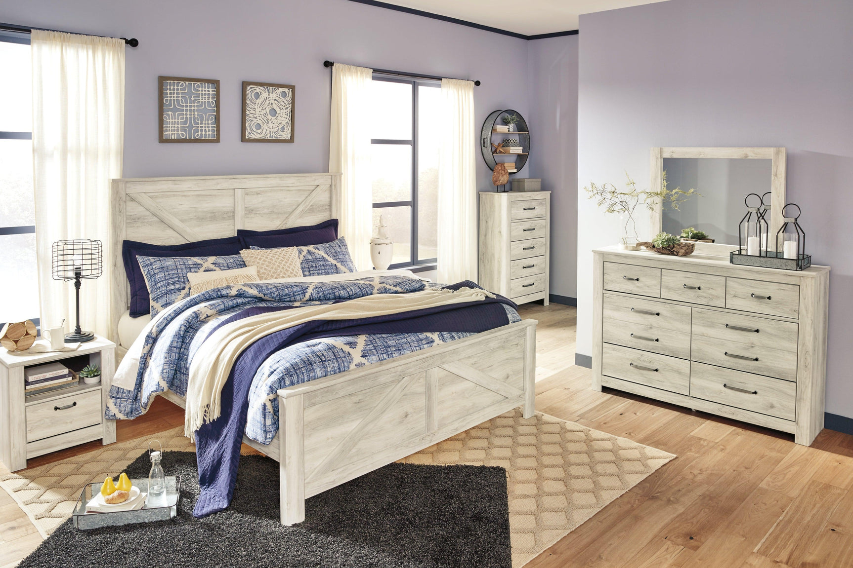 Bellaby Whitewash King Crossbuck Panel Bed styled in bedroom