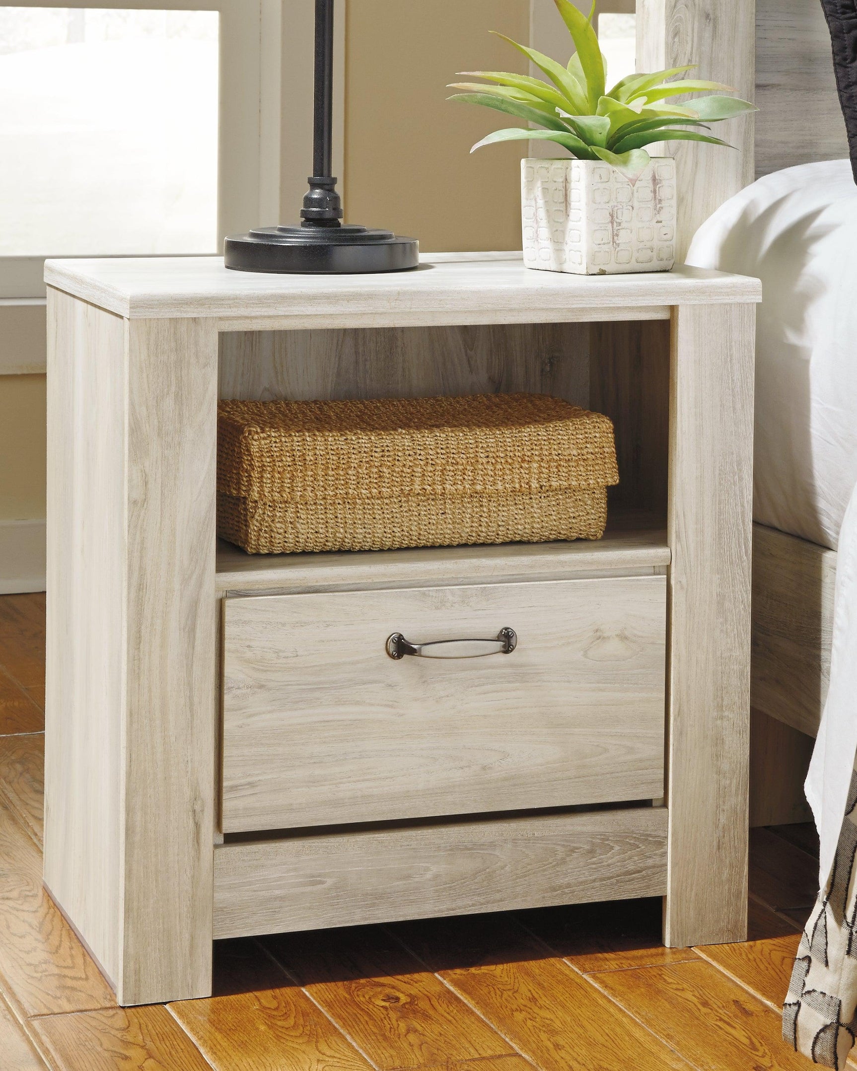 Top view of Bellaby Whitewash Nightstand surface with whitewashed oak grain finish