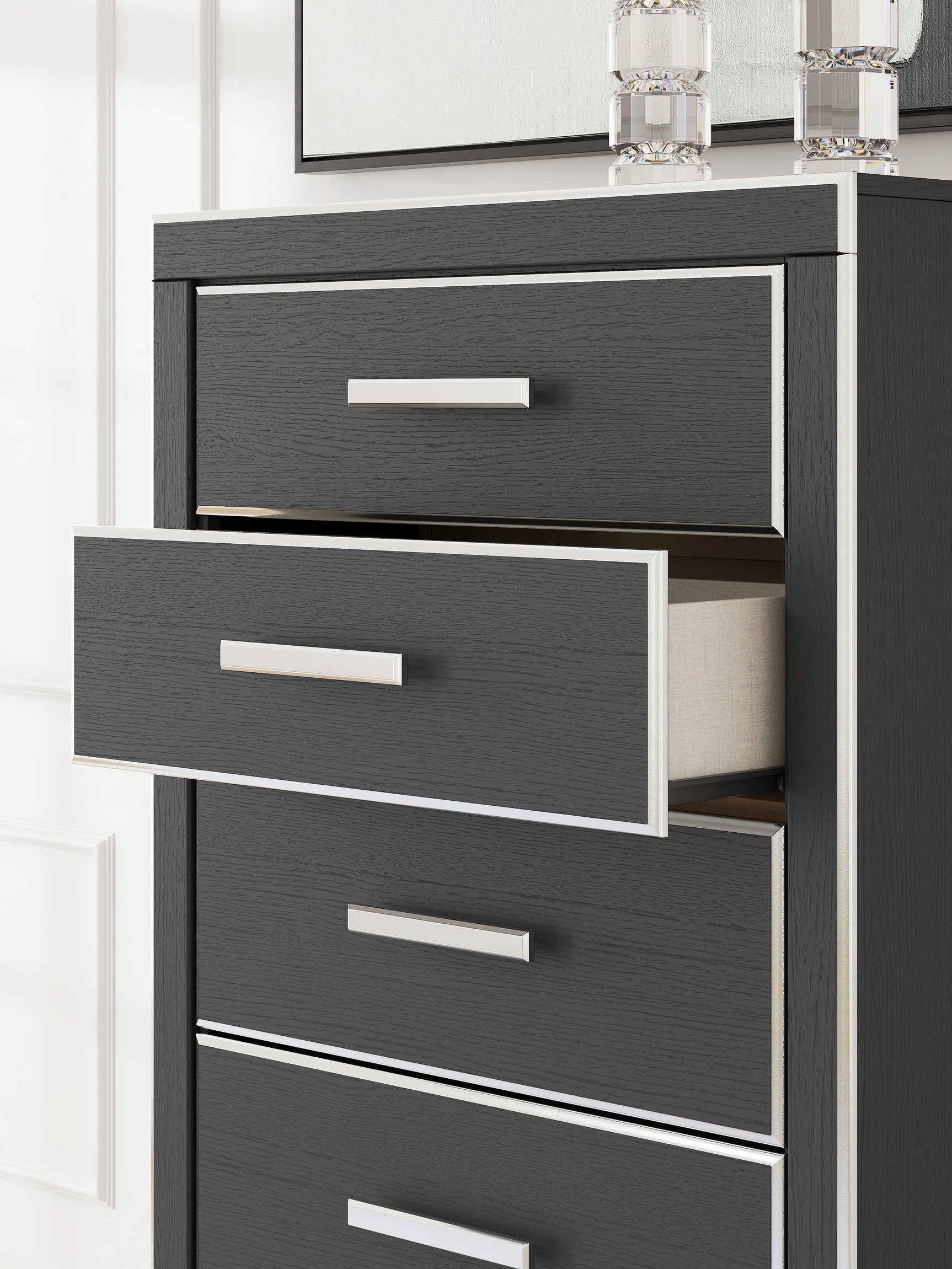 Side profile of Zuraleus black chest of drawers