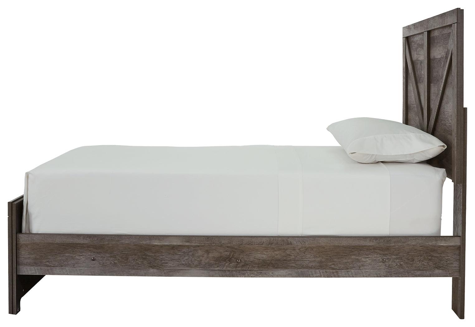 Side profile of Wynnlow Gray Twin Crossbuck Panel Bed