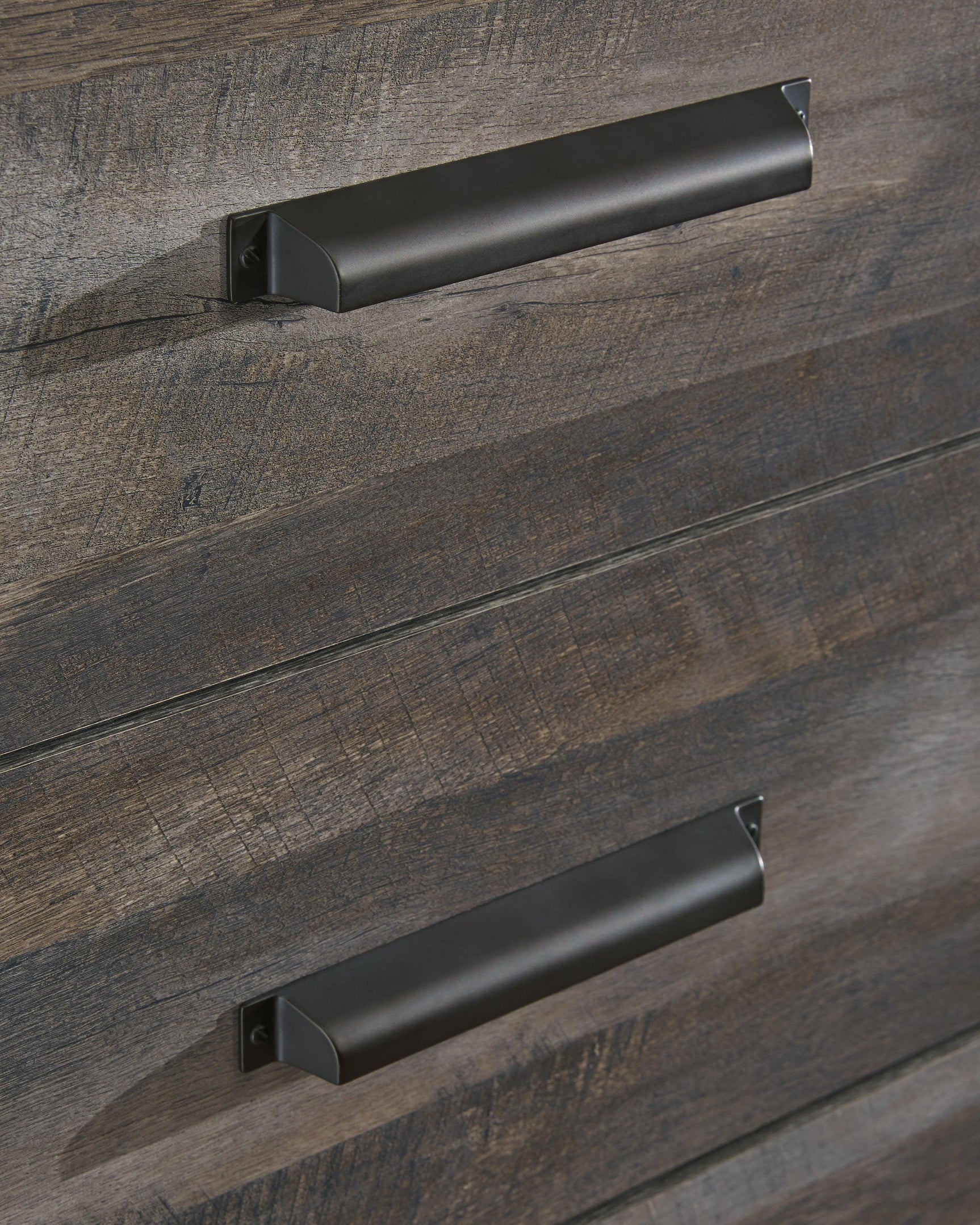 Wynnlow Gray 5-Drawer Chest distressed gray wood finish close-up