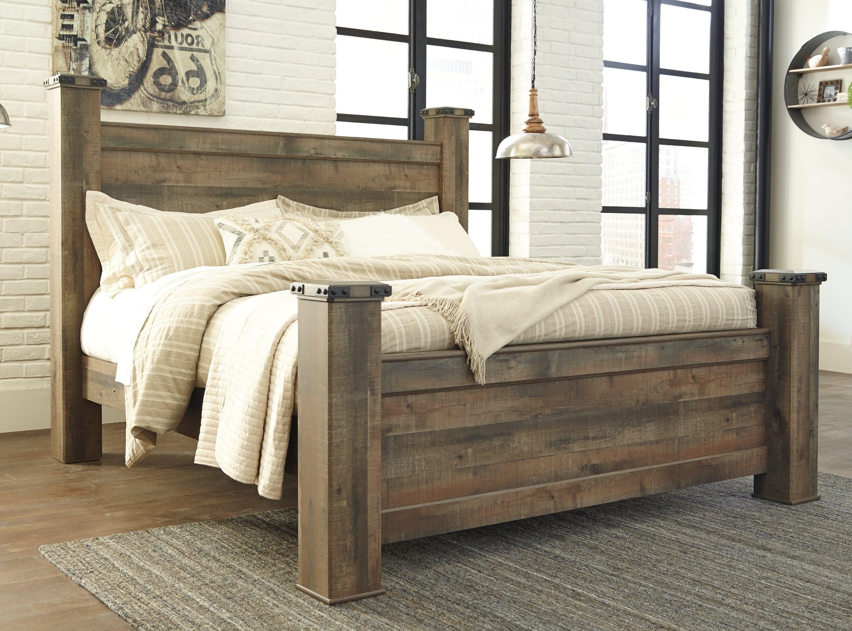 Close-up on Trinell bed's nailhead trim and wood grain texture